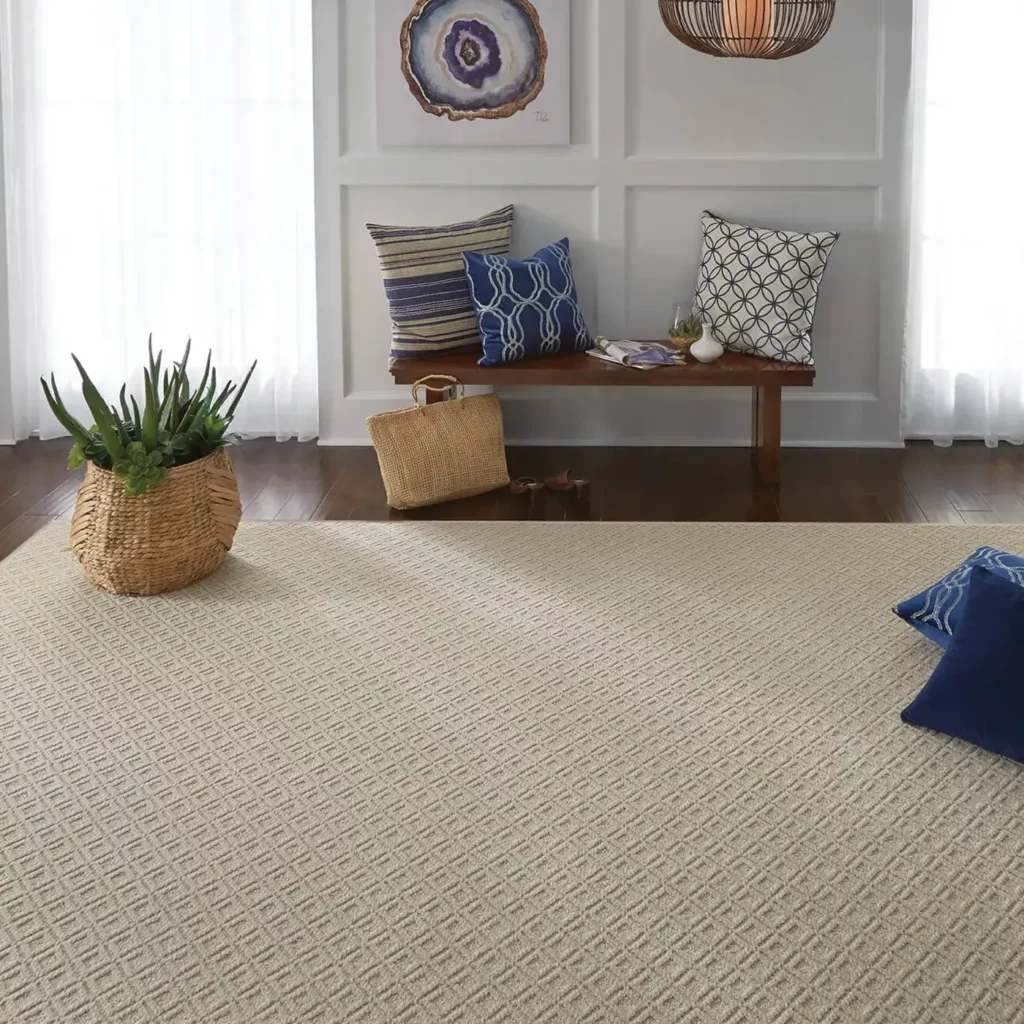 A Shaw Floors area rug in a light sand color | The Floor Store